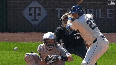 A Baseball Player With The Number 22 On His Jersey Is Swinging A Bat GIF