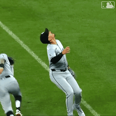 A Baseball Player With The Number 23 On His Jersey Is Hugging Another Player GIF