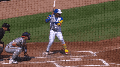 A Baseball Player With The Number 23 On His Jersey Swings At A Ball GIF