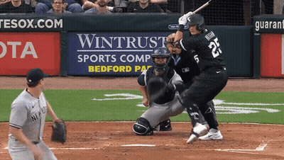A Baseball Player With The Number 25 On The Back Of His Jersey Swings At A Pitch GIF