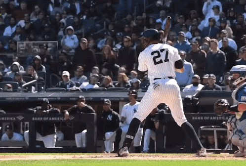 A Baseball Player With The Number 27 On The Back Of His Shirt GIF