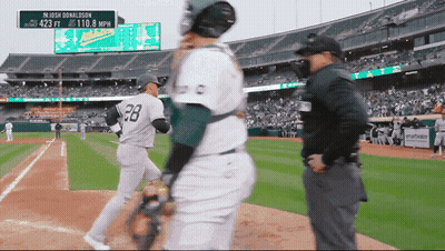 A Baseball Player With The Number 28 On His Back Stands On The Field GIF