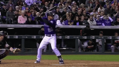 A Baseball Player With The Number 28 On His Jersey Swings His Bat GIF