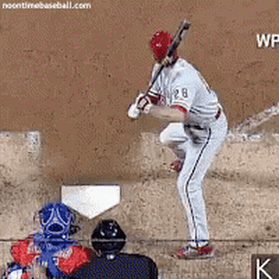 A Baseball Player With The Number 28 On His Shirt GIF