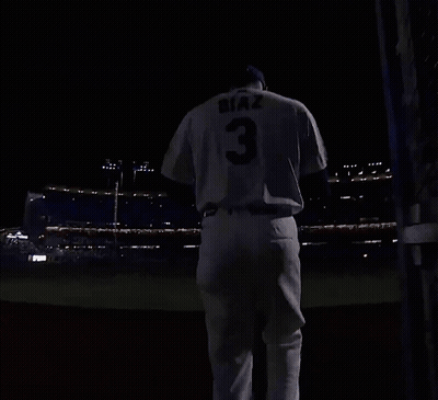 A Baseball Player With The Number 3 On His Jersey Is Running On A Field At Night GIF