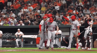 A Baseball Player With The Number 35 On His Jersey Is Being Helped By His Teammates GIF