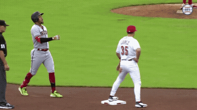 A Baseball Player With The Number 35 On His Jersey Stands On The Base GIF
