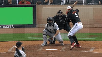 A Baseball Player With The Number 4 On His Jersey Is Swinging At A Pitch GIF