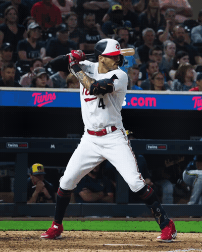 A Baseball Player With The Number 4 On His Jersey Swings His Bat GIF
