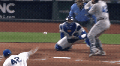 A Baseball Player With The Number 42 On The Back Of His Shirt GIF
