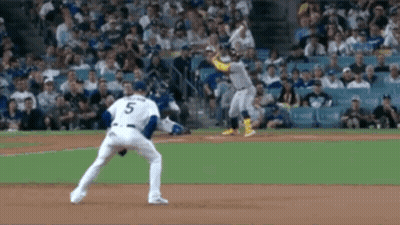 A Baseball Player With The Number 5 On His Jersey Is Getting Ready To Throw The Ball . GIF