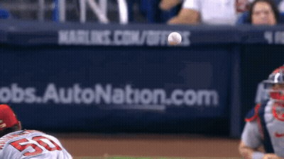A Baseball Player With The Number 55 On His Jersey Is About To Catch A Ball GIF