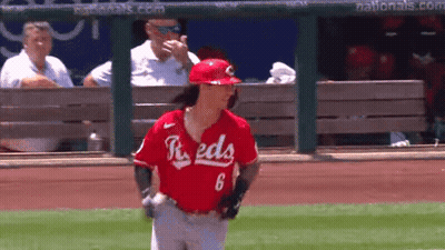 A Baseball Player With The Number 6 On His Jersey Is Walking On The Field . GIF
