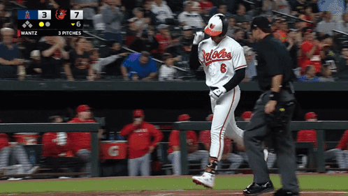 A Baseball Player With The Number 6 On His Jersey Is Walking Towards A Referee GIF