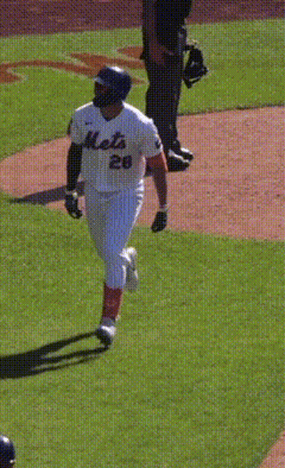 A Baseball Player With The Number 65 On Their Back GIF