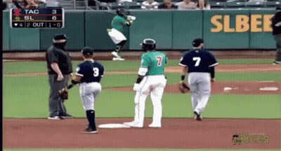 A Baseball Player With The Number 7 On His Back Is Jumping In The Air GIF