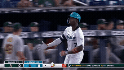 A Baseball Player With The Number 7 On His Jersey Is Running Towards Home Plate GIF