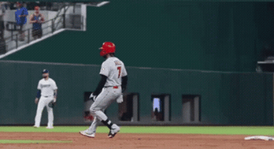 A Baseball Player With The Number 7 On His Jersey Is Standing On The Base GIF