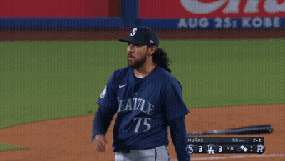 A Baseball Player With The Number 75 On His Jersey Stands On The Field GIF
