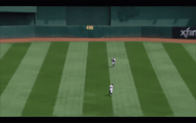 A Baseball Player With The Number 8 On His Back Is Sliding Into Base GIF
