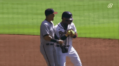 A Baseball Player With The Number 8 On His Jersey Is Talking To Another Player GIF