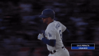 A Baseball Player With The Number 8 On His Jersey Reaches Up To Catch A Ball GIF