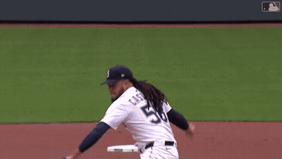 A Baseball Player With The Number 8 On The Back Of His Jersey Swings At A Pitch GIF