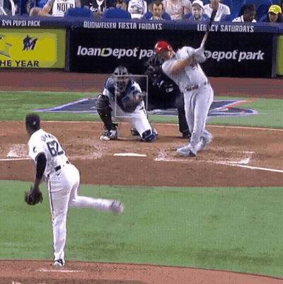 A Baseball Player With The Number 82 On His Jersey Swings At A Pitch GIF