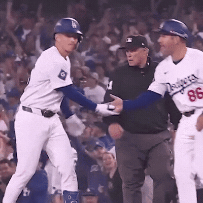 A Baseball Player With The Number 86 On His Jersey Is Talking To An Umpire GIF