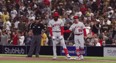 A Baseball Player With The Number 98 On His Jersey Stands On The Base GIF