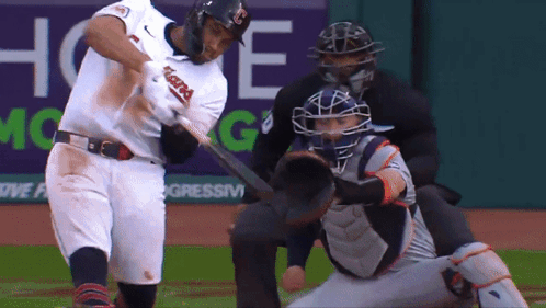 A Baseball Player With The Word Indians On His Jersey Swings His Bat GIF