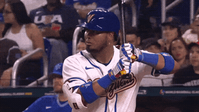A Baseball Player With The Word Milwaukee On The Front Of His Jersey GIF