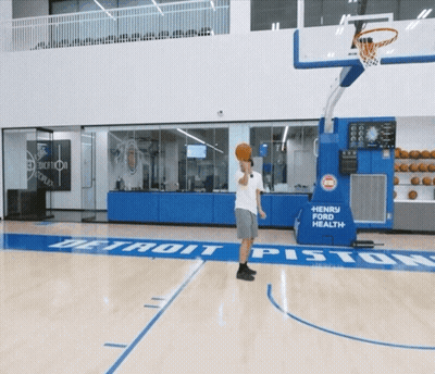 A Basketball Court With A Henry Ford Health Sign On It GIF