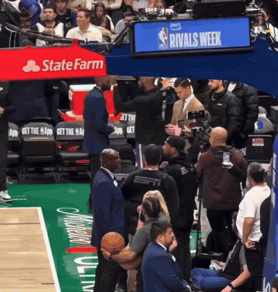 A Basketball Court With A Sign That Says Rivals Week In The Background GIF