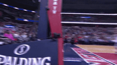A Basketball Court With A Spalding Sign On It GIF