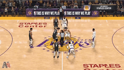 A Basketball Game Being Played At Staples Center GIF