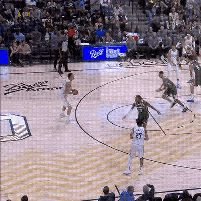 A Basketball Game Being Played At The Ball Arena GIF