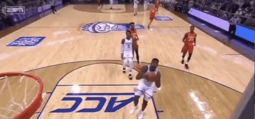 A Basketball Game Being Played On A Court That Says Acc GIF