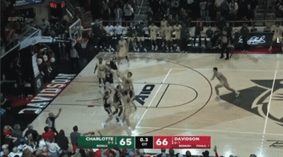 A Basketball Game Between Charlotte And Davidson With The Score 65 To 66 GIF