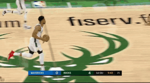 A Basketball Game Between The Mavericks And The Bucks Is Being Played GIF