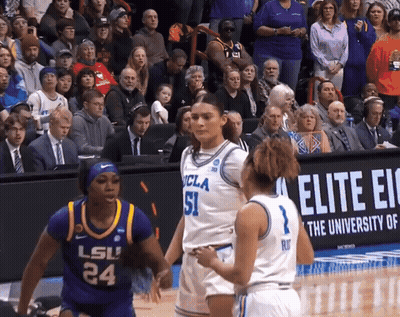 A Basketball Game Between Ucla And Lsu Is Being Played In Front Of A Crowd GIF