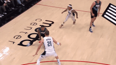 A Basketball Game Is Being Played At The Magic Center GIF