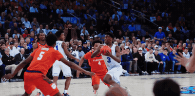 A Basketball Game Is Being Played Between Clemson And Virginia Tech GIF