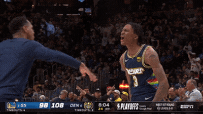 A Basketball Game Is Being Played Between Den And Bones GIF