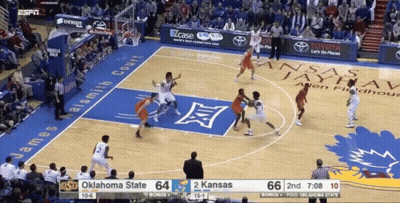 A Basketball Game Is Being Played Between Oklahoma State And Kansas State GIF