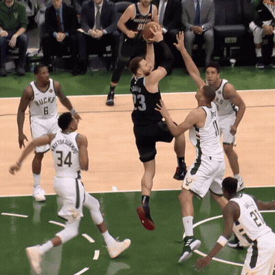 A Basketball Game Is Being Played Between The Bucks And The Wizards GIF