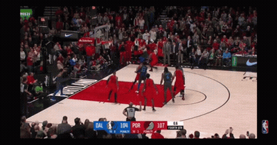 a basketball game is being played between the dallas and portland trail blazers