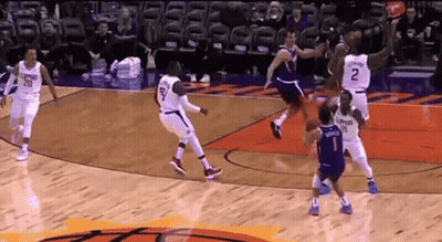 A Basketball Game Is Being Played Between The Memphis Grizzlies And The Phoenix Suns . GIF