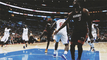 A Basketball Game Is Being Played Between The Miami Heat And The Denver Broncos GIF