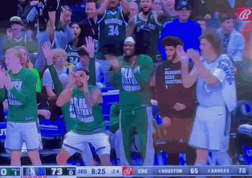 A Basketball Game Is Being Played Between The Milwaukee Bucks And Houston Rockets GIF